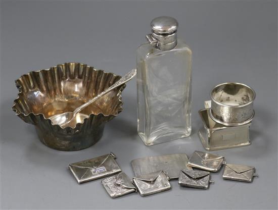 Twelve items of small silver and plated ware including six stamp envelopes, napkin ring, spoon etc.